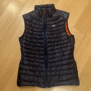 Arcteryx Woman’s puffer vest - blue and orange - woman’s XS
